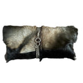 Fur pouch with a chain detail on a white background
