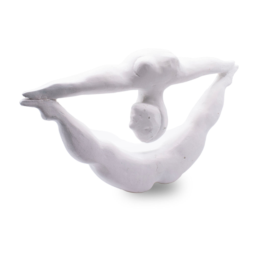 White acquacast sculpture of a contortionist nude figure on a white background